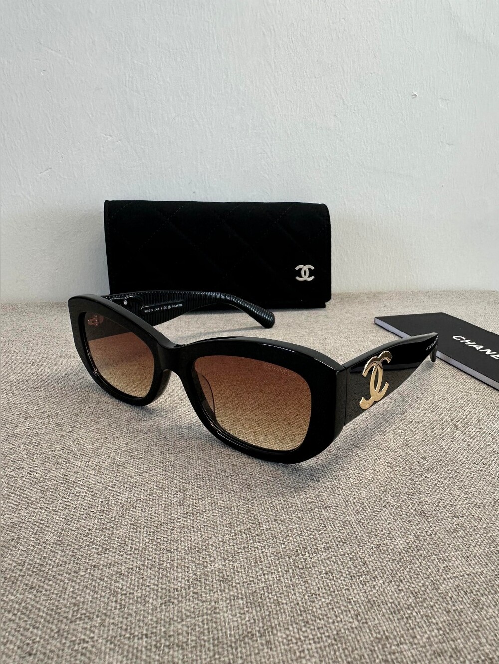 CHANEL Black Frame Sunglasses with Gold CC Logos and Brown Gradient Lenses